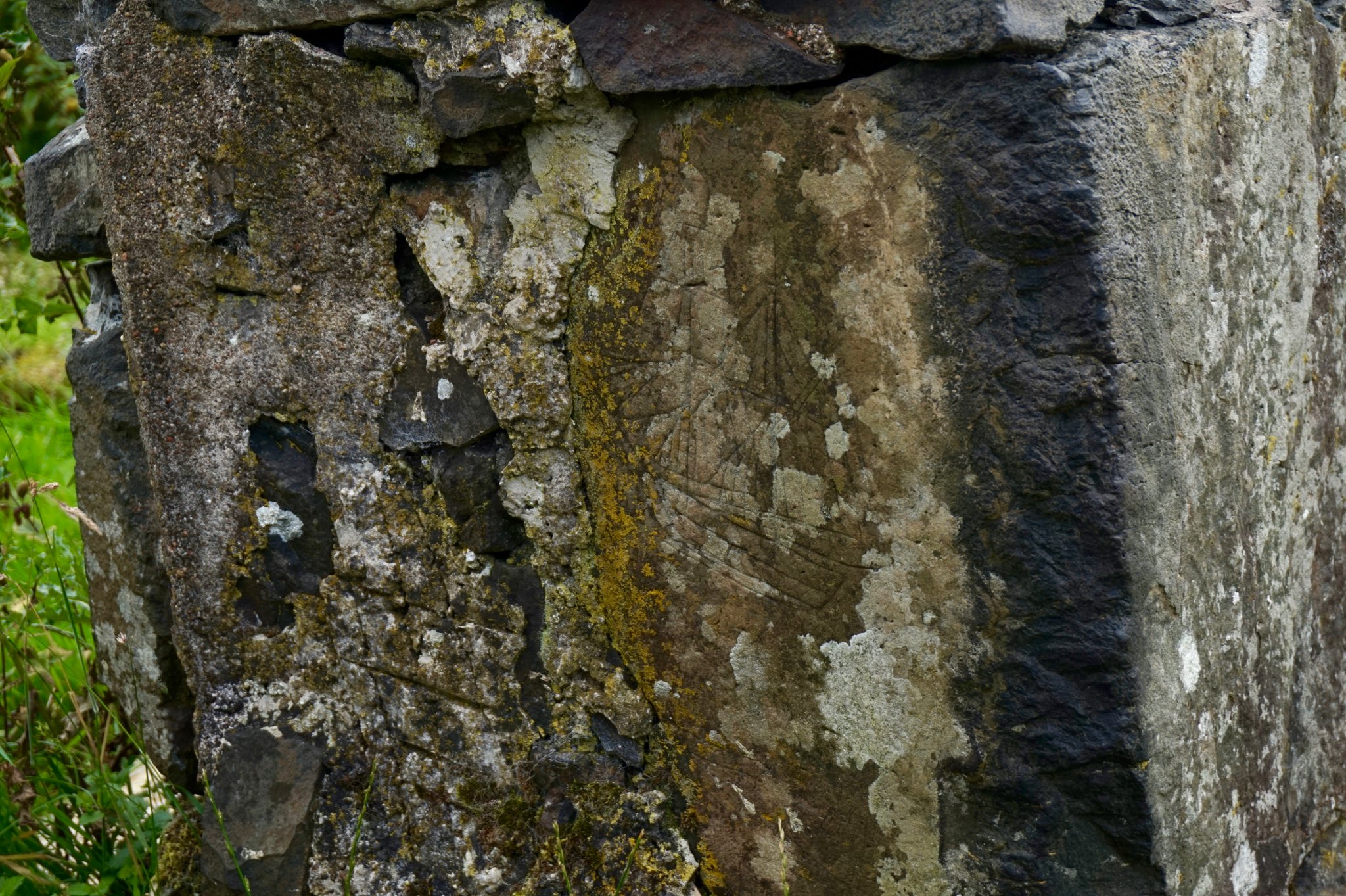Carving of a ship on a ruined cottage on the grounds of Glengorm Castle